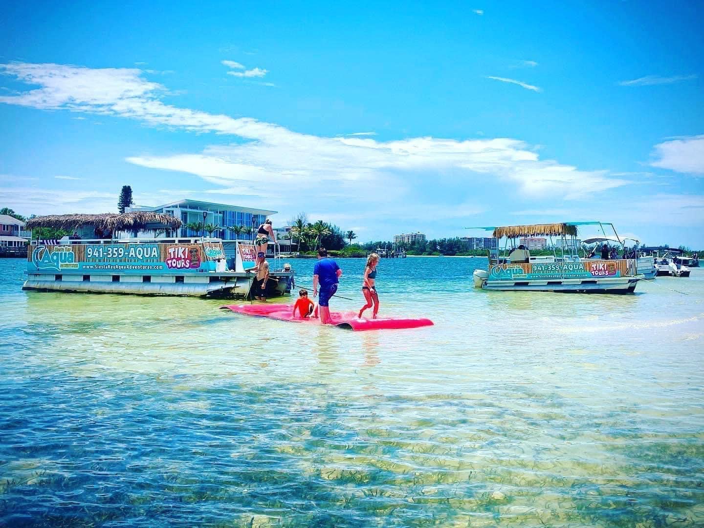 a group of people on a boat in a body of water